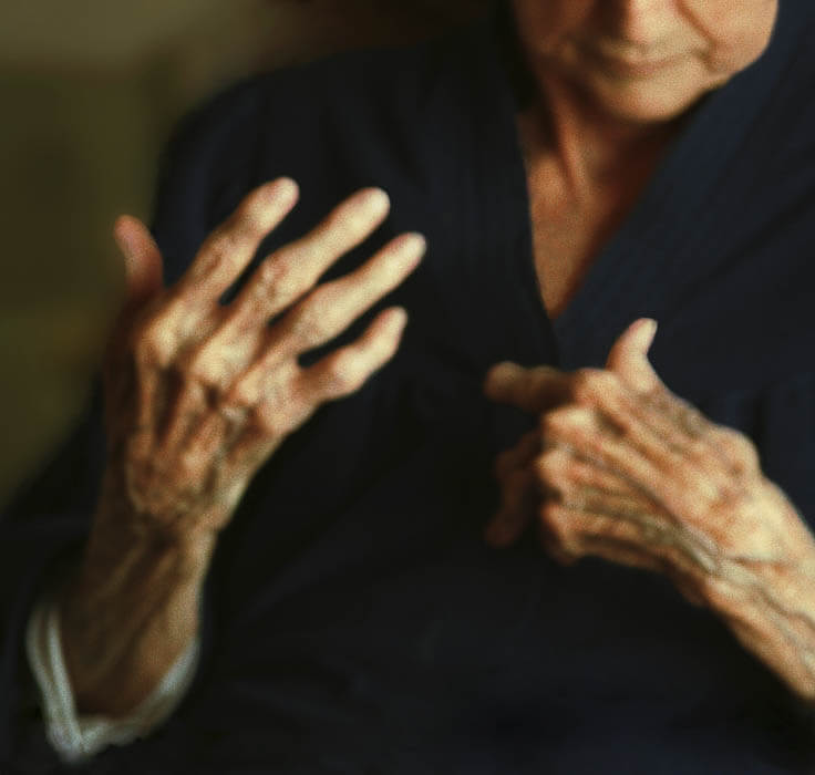 older person, hand gesturing inward