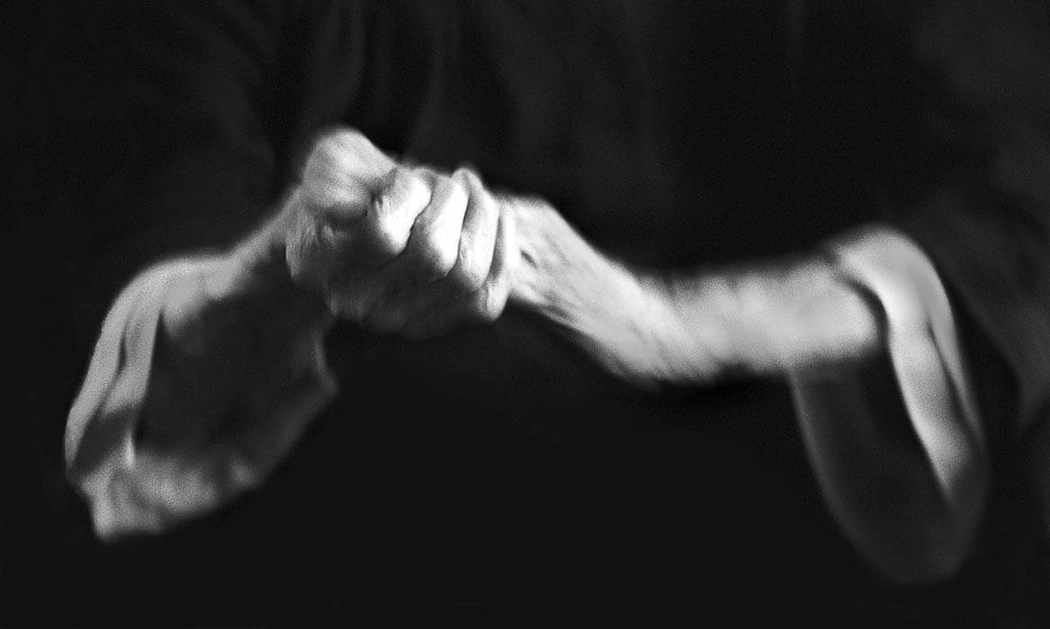 wringing hands in motion and blurred, black and white