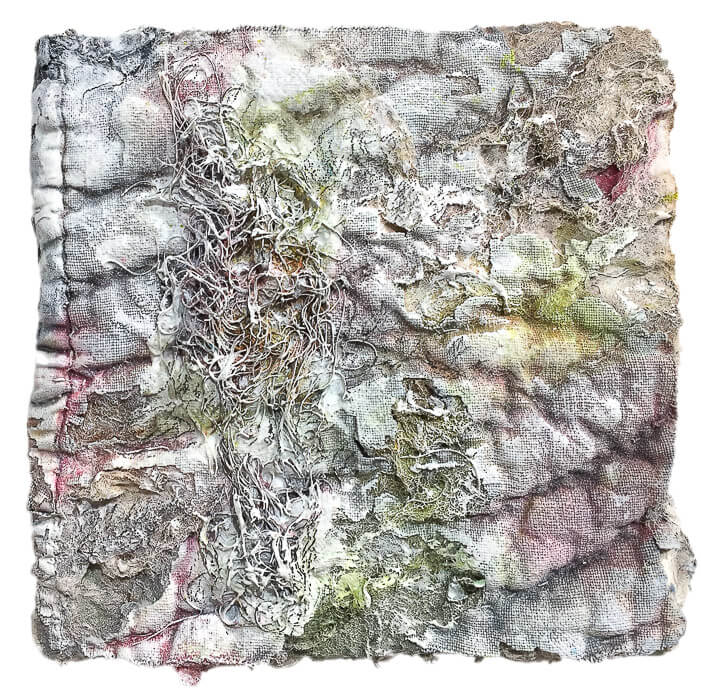 a burnt quilt fragment, light colors, graphite, thread, lots of texture