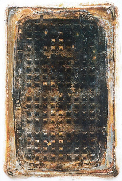 Mixed media art with rust, carbon, acrylic, and a waffle iron image.