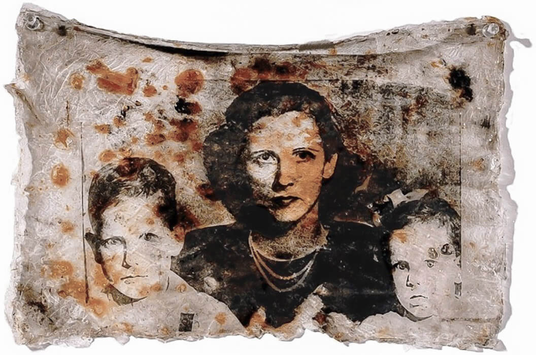photographic image of a mother and children transferred to an acrylic skin with embedded rust and carbon