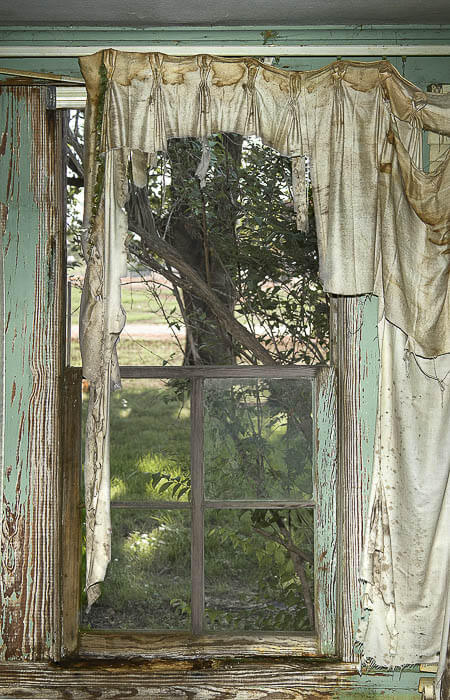 weathered window, tattered torn curtain