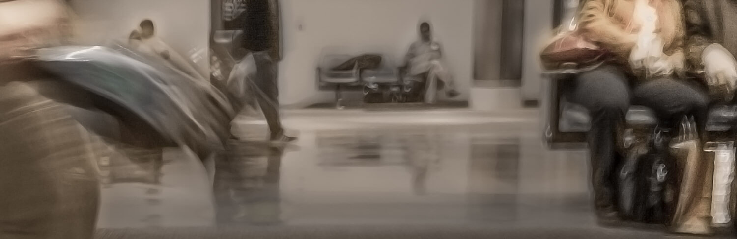 blurred image of people waiting and moving in an airport