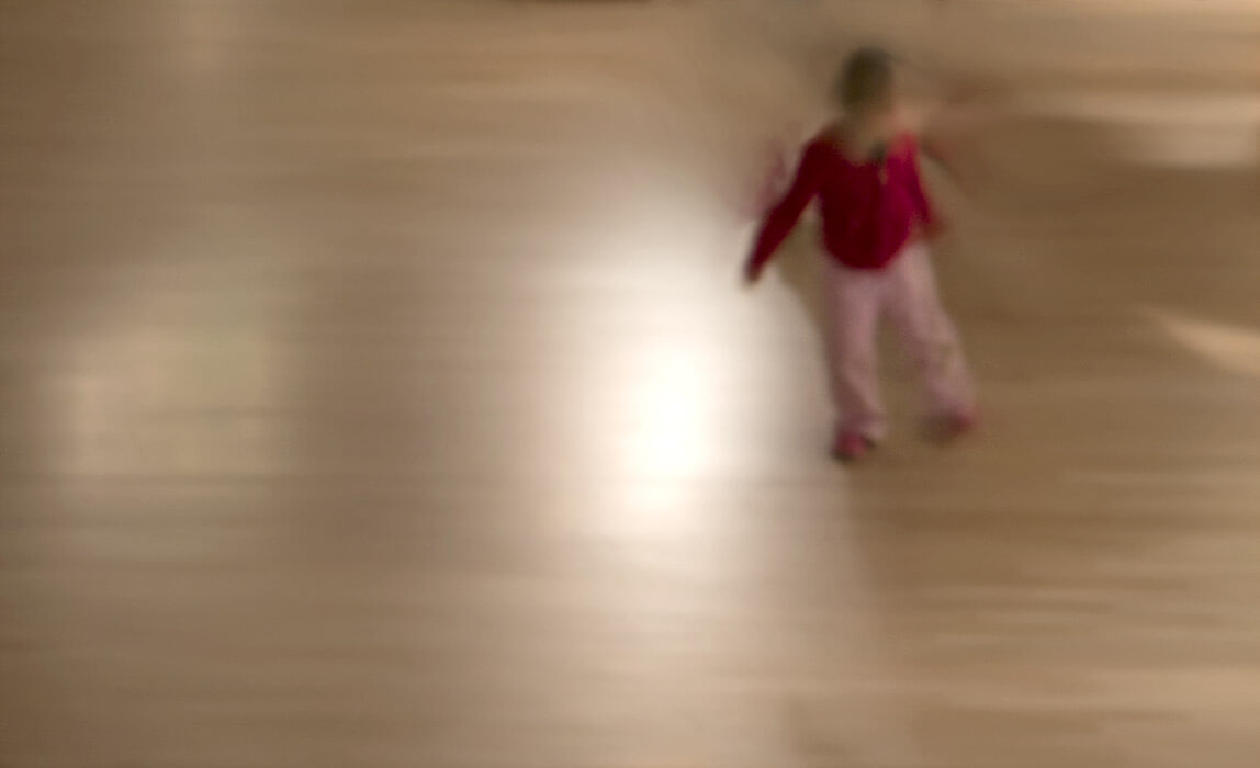 child dancing, red shirt, motion blur