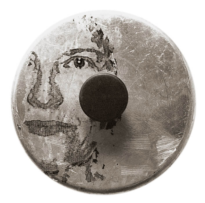 image transfer, woman's face, intense look, stratches on the metal