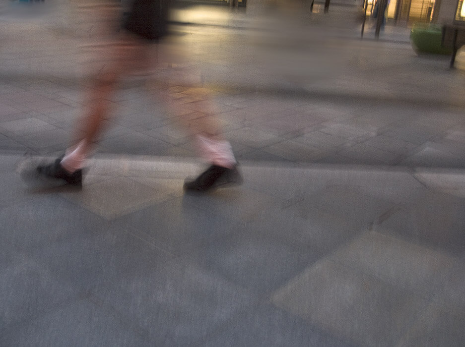 feet of someone walking, motion blur