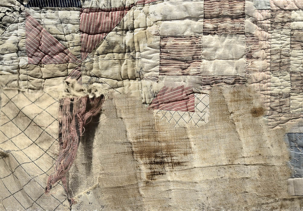 digitally stitched together old quilts fragments, stains, patterns, torn