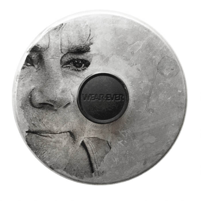 woman with tears in her eyes, image transfer on a metal pot lid with a WearEver handle